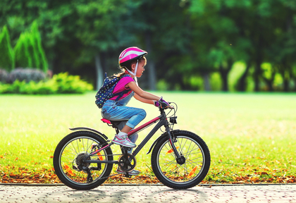 child biking in a california master-planned community