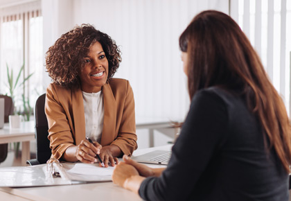 Two business people talking about association insurance