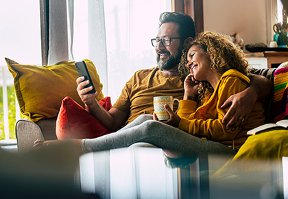 couple researching HOA reserve study companies