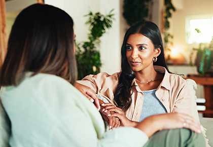 women discussing how to find the best HOA reserve study companies