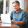 man on laptop with coffee