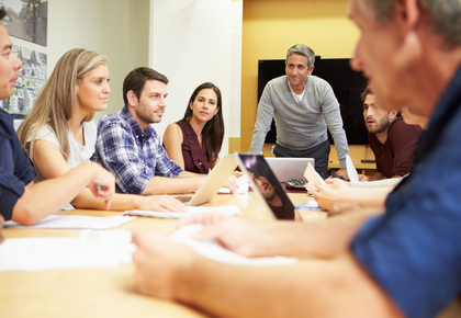 An HOA board considers a management partner at a conference table