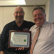 Rich Dziadoz (left) receives Best Maintained Vintage Award from FirstService Residential, presented by Robert Meyer (right).